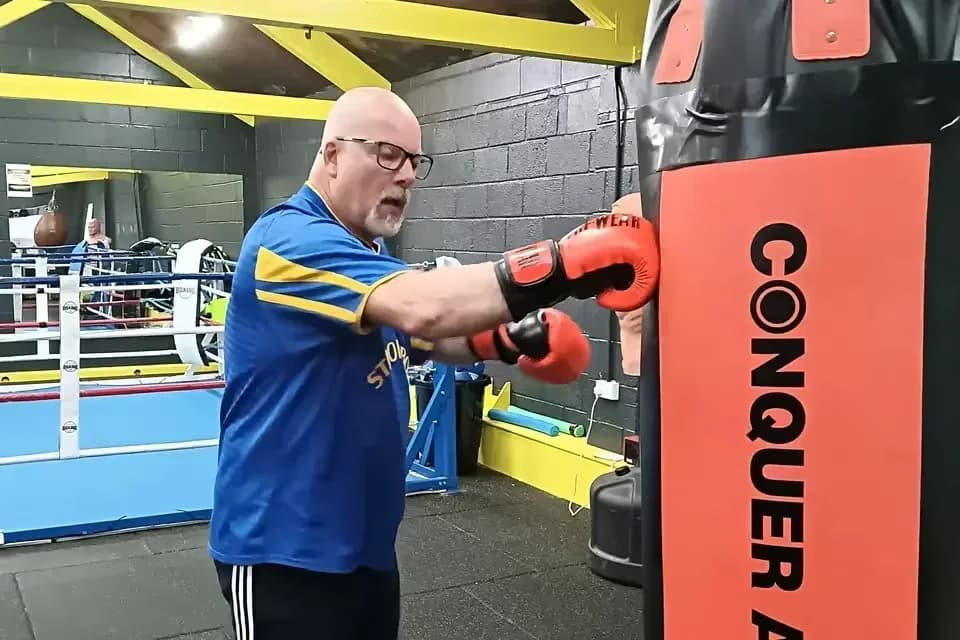A Boxing for Parkinson's training session — hands wrapped, gloves on, ready to train