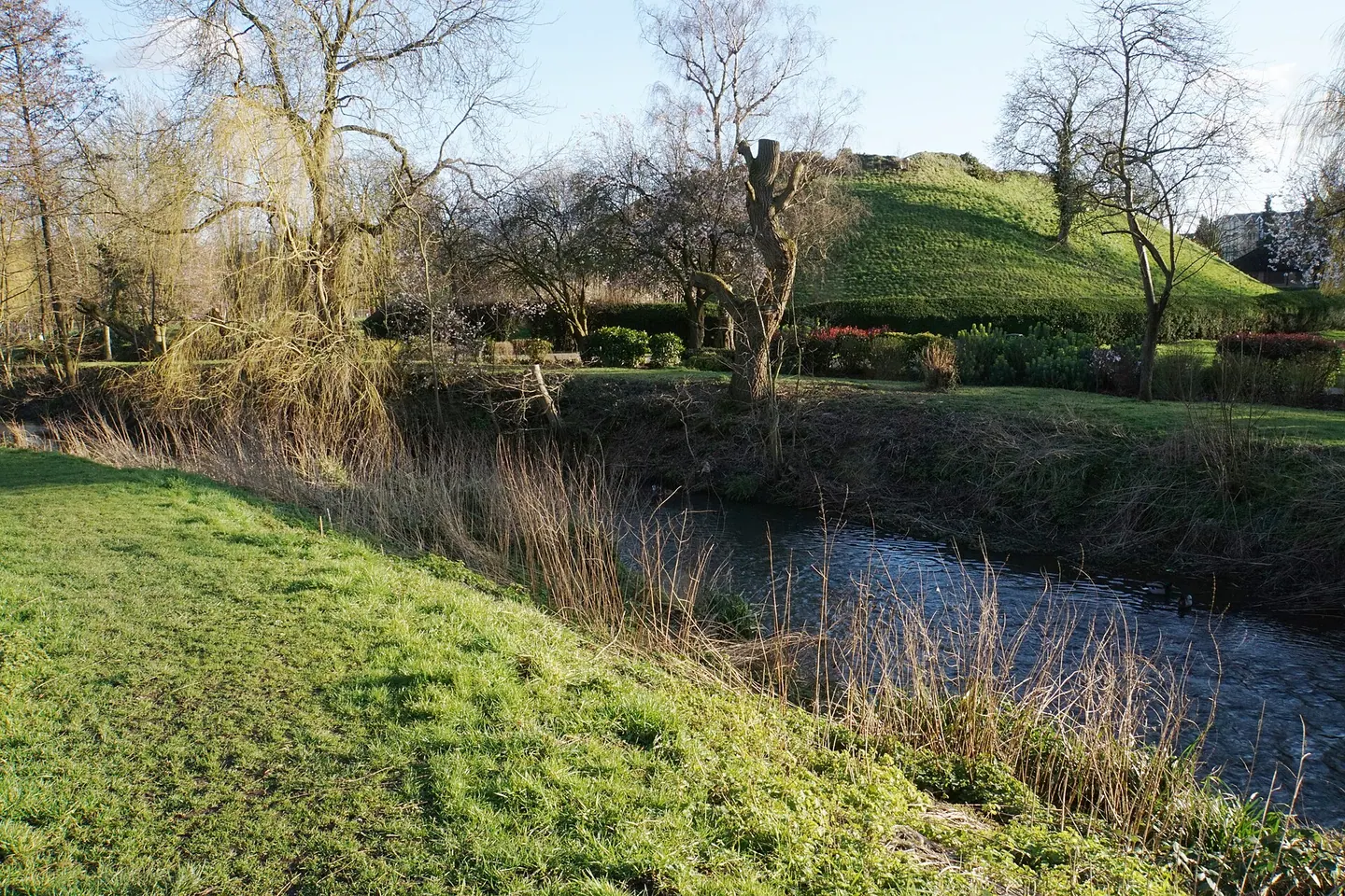 The sunlit River Stort at Bishop's Stortford, by the Waytemore Castle mound
