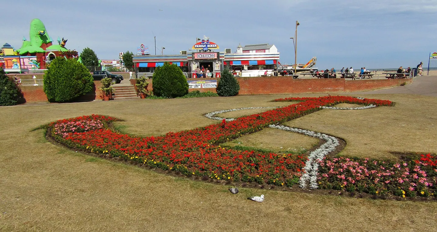 Marine Parade Gardens at Great Yarmouth, with carpet bedding and the seafront behind