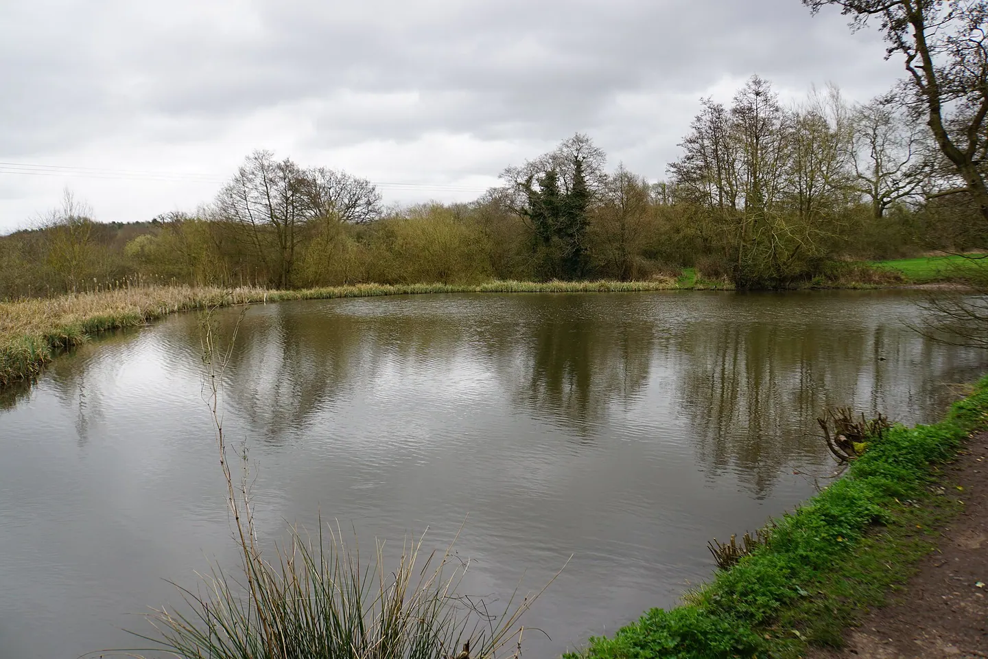 The millpond and lakeside path in Arrow Valley Country Park, Redditch