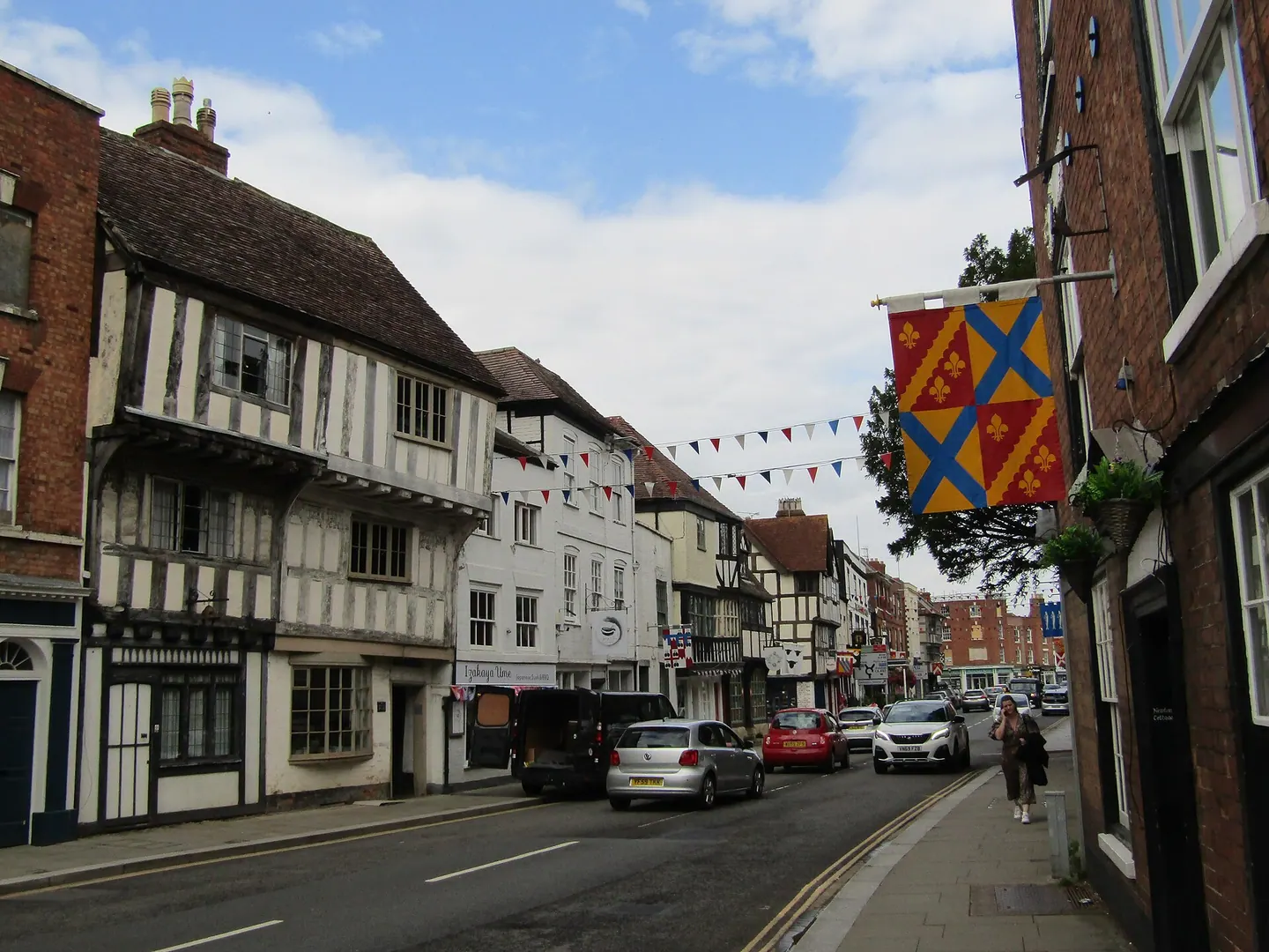 Church Street's timber-framed streetscape at Tewkesbury, with bunting strung across